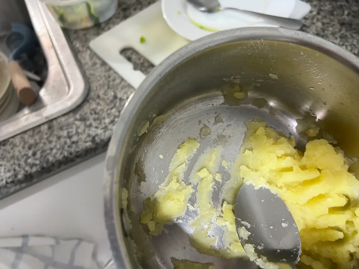 Step 3: Mash the potatoes in the pot with the soy milk
